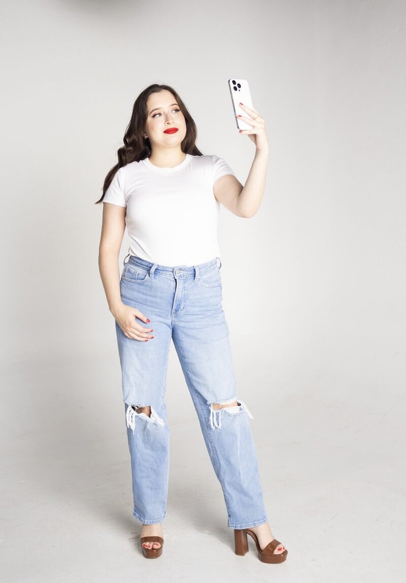 Hampton Roads female digital marketing consultant working on laptop in black and white