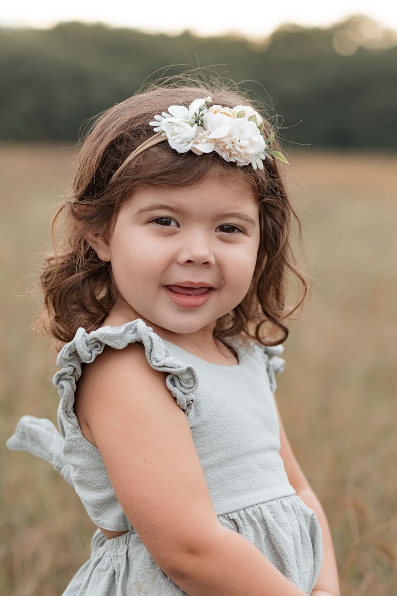 man leaning on a poll outside during a branding session with cinder and ivory photography.