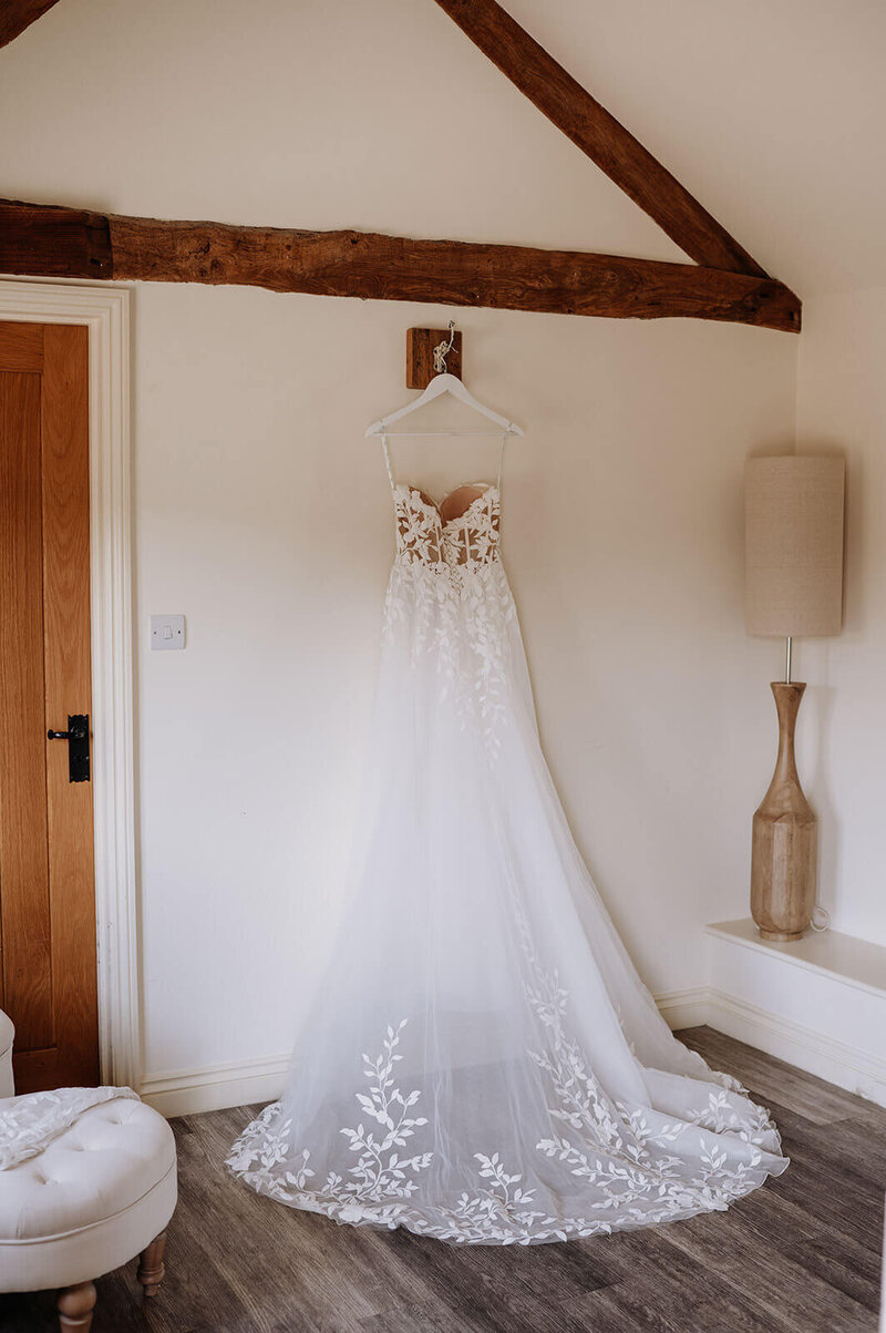 Wedding dress in the light and elegant dressing room at Caswell House