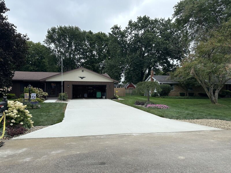 Replaced concrete driveway leading to a ranch home in Goshen, IN