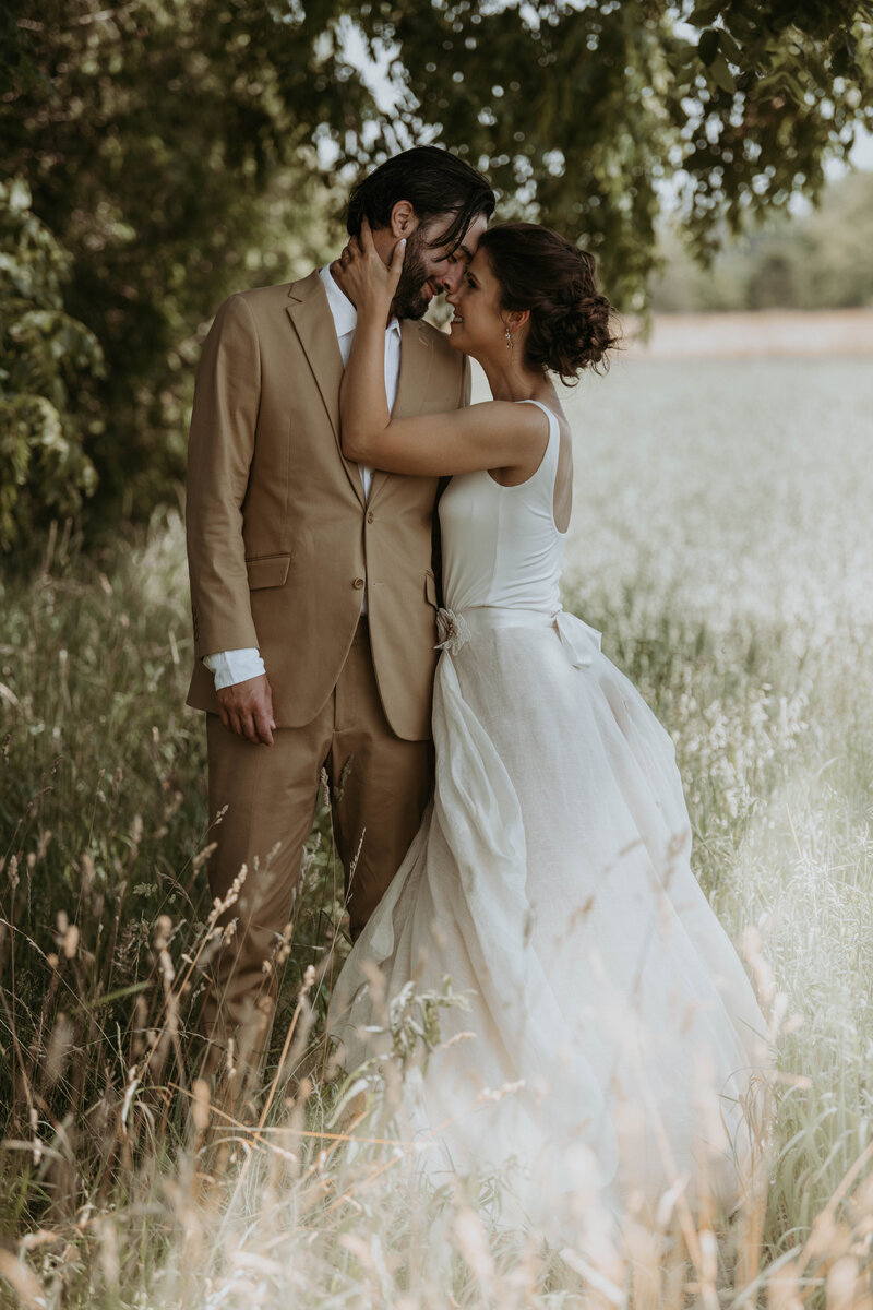 bride and groom running on beach in  goderich