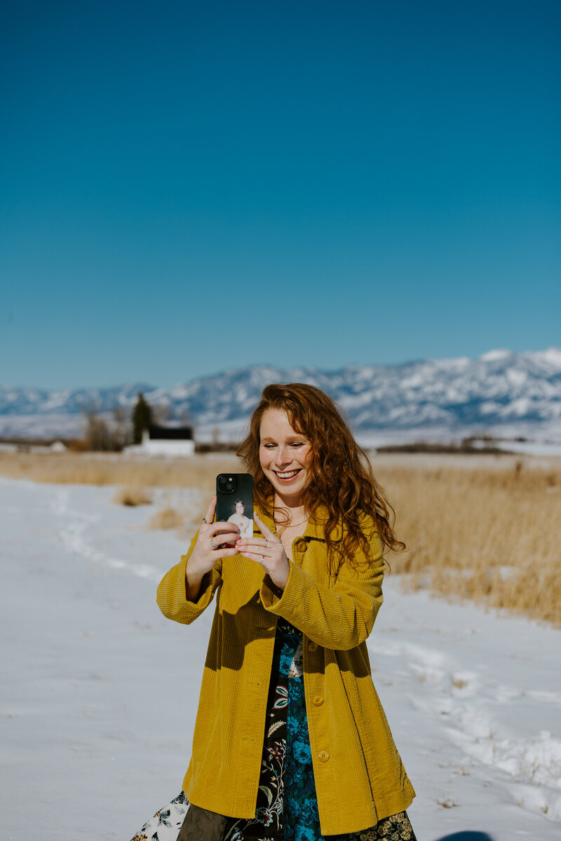 social media content creator in Bozeman Montana filming on her iphone