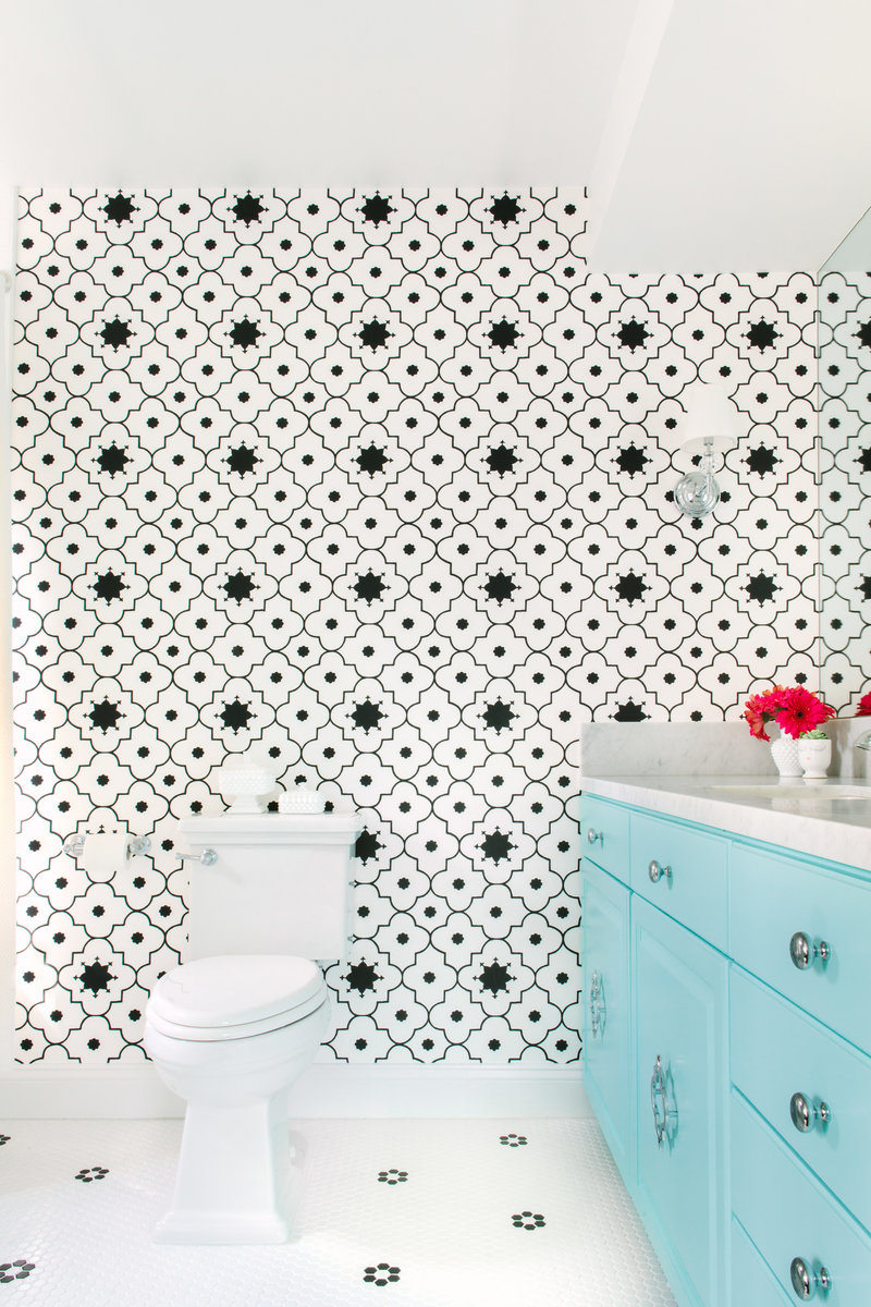 Bathroom with turquoise vanity and Martyn Lawrence Bullard Taj Trellis wallpaper