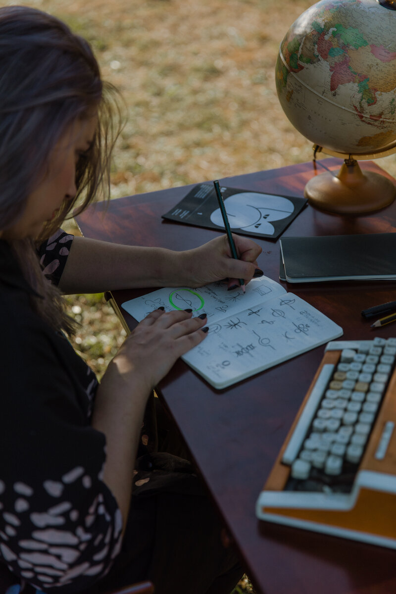 Brand designer Marta Custic sketching brand concepts at her Zadar workspace, embodying the bridge between Mediterranean creativity and international design excellence