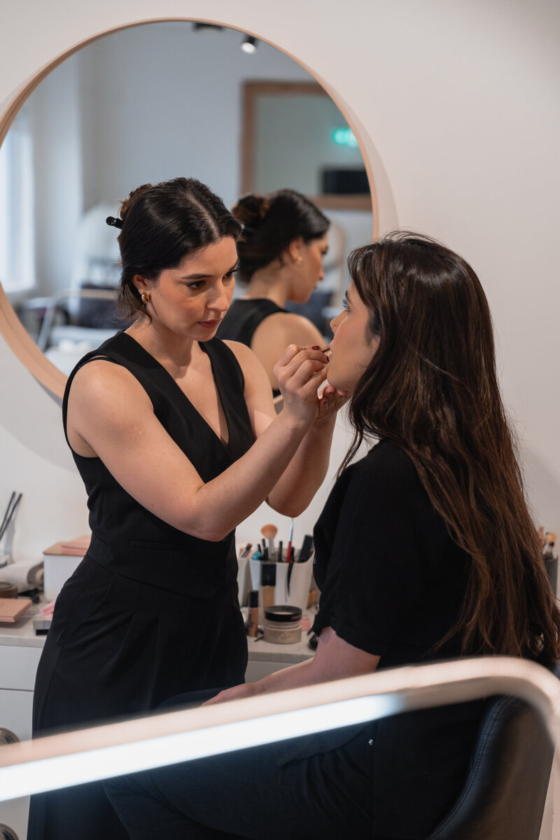 photo of woman getting her makeup done but dublin makeup artist