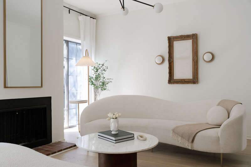 Minimalist living room with white long couch