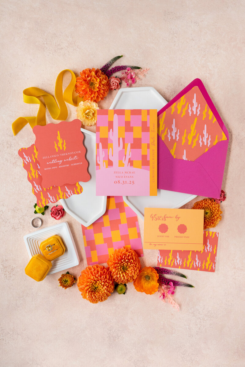 A retro themed wedding invitation suite with record place cards.