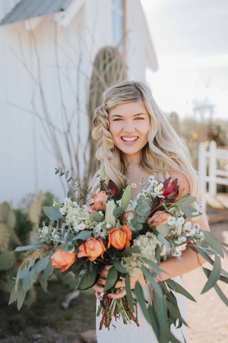 Lake Tahoe wedding photographer captures bride holding bridal bouquet outdoors