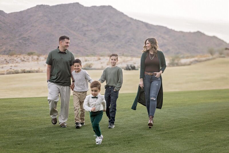 wife and husband with three sons