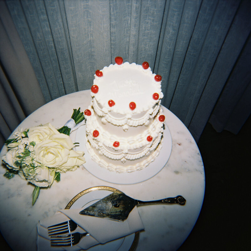Vintage wedding cake with cherries at a Wisconsin wedding.