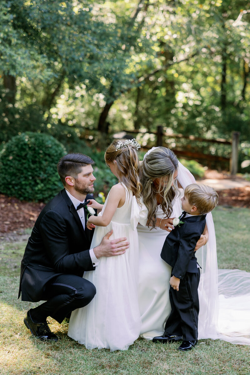 Fall wedding at The Club in Birmingham Alabama bride and groom first look with family. Kindred Weddings. Maddie Moore Photography.