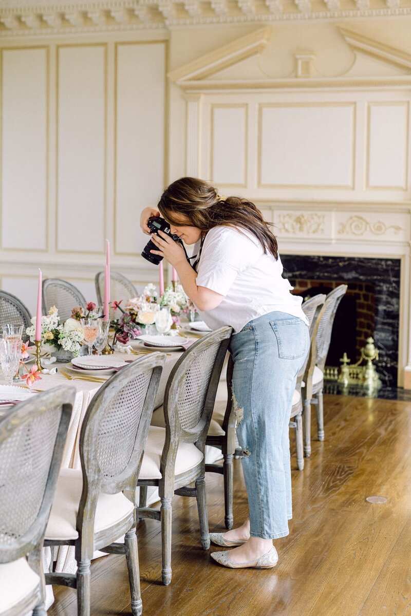Carly photographing a tablescape