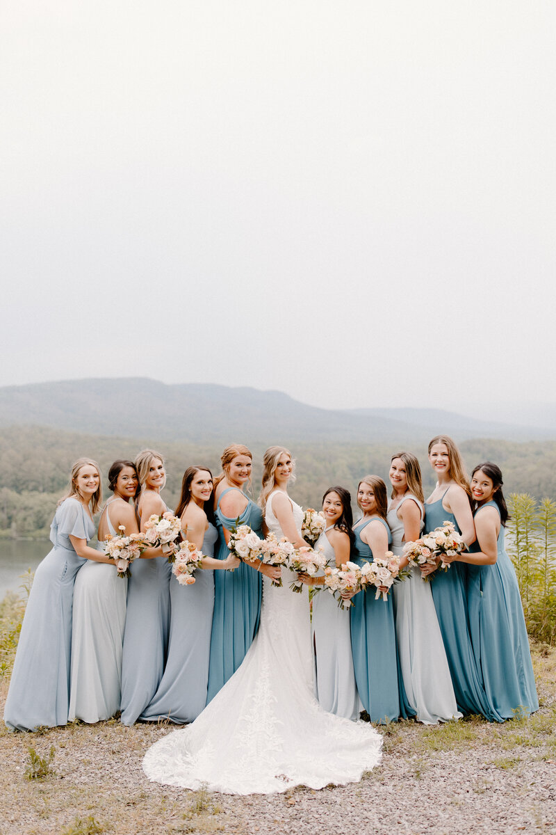 bride and bridesmaids look over their shoulders at the camera