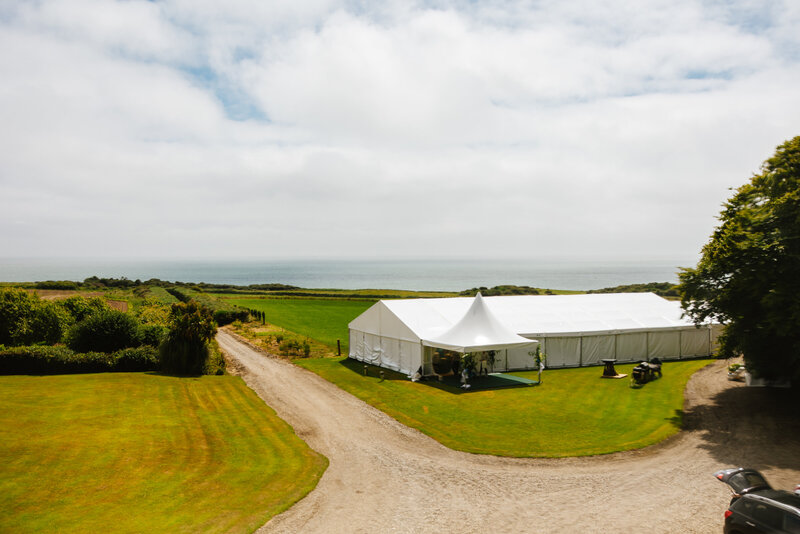 Countryside outdoor tent Irish wedding with a gravel road