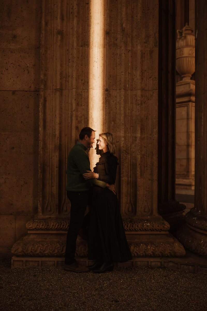 San Francisco couple with beam of light at landmark location Palace of Fine Arts