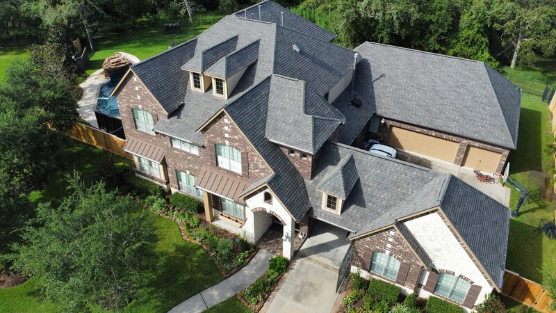 Dallas, TX home with birdseye view of roof replacement and repair done