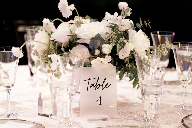 white and black table numbers at wedding