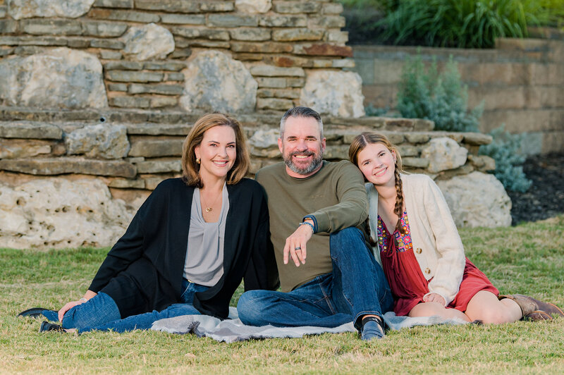 Red, Army Green, Gray, Black Family Portrait. Family of 3 seated. Photo taken by Lydia Teague Photography.