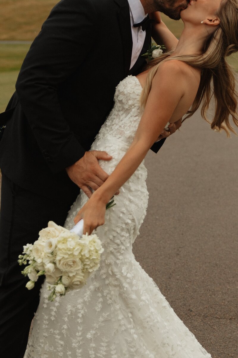 bride and groom share a kiss on wedding day in pei