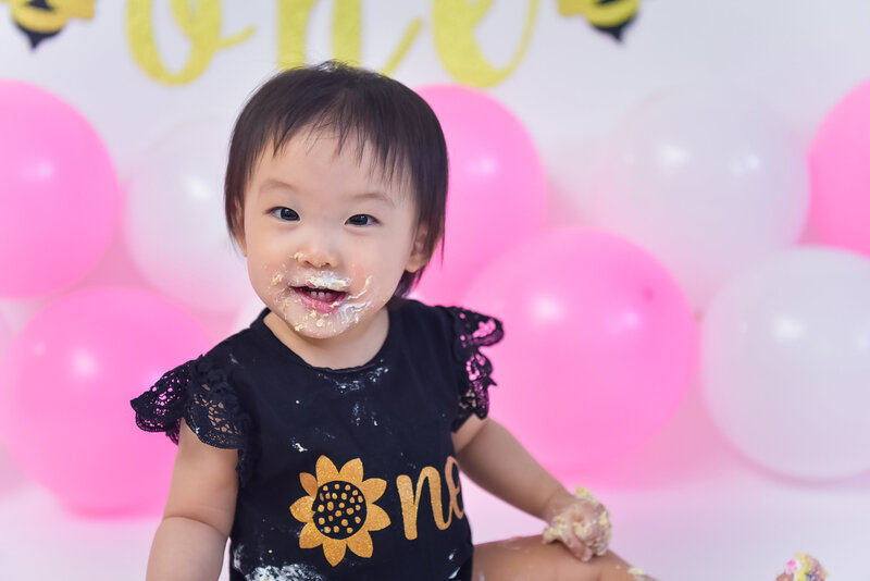 A one-year-old at her cake smash photo session.
