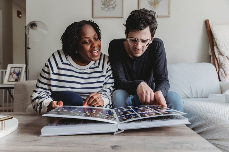 couple looking at their wedding photo album