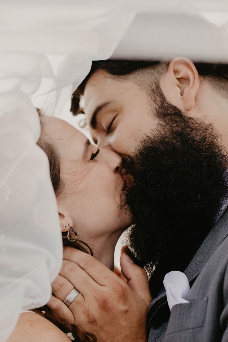 couple kissing on beach