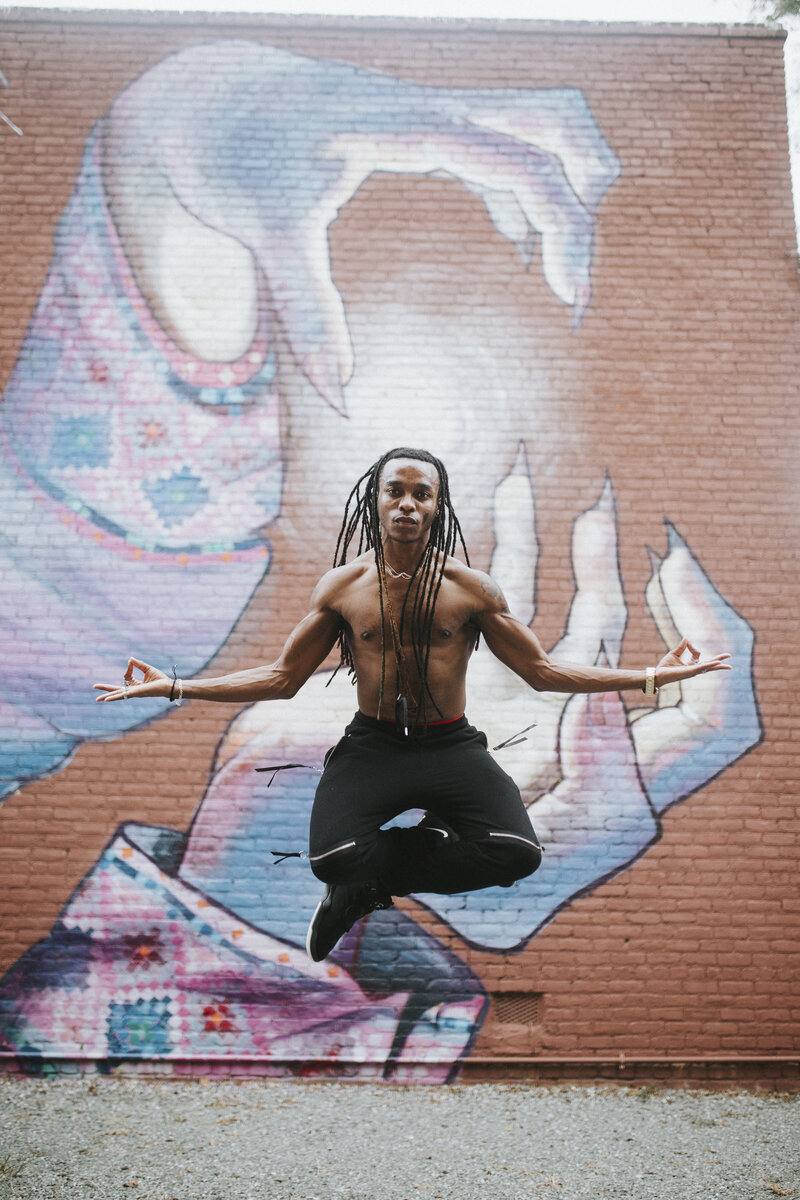 Richmond dancer in an urban location with a mural wall