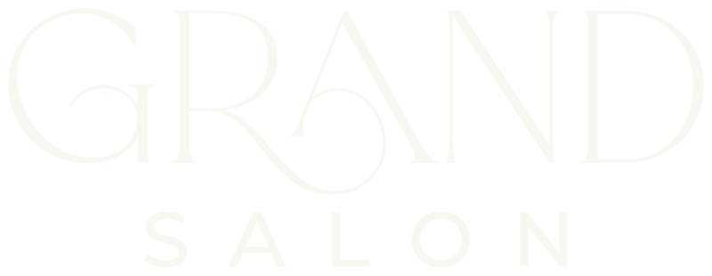 White text logo on a transparent background that reads GRAND in large, elegant font with a stylized letter A, and SALON in smaller uppercase letters below—perfect for a grand salon website design.