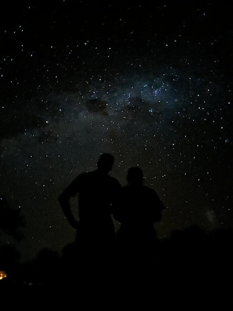 Stars at Simanya Lodge in Nkurenkuru, with people observing