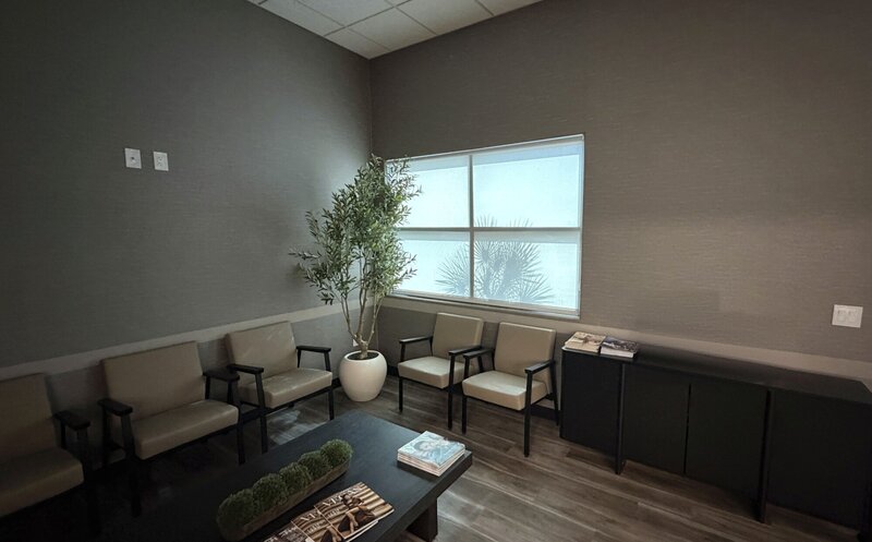 Commercial solar roller shades on a waiting room corner window in Las Vegas