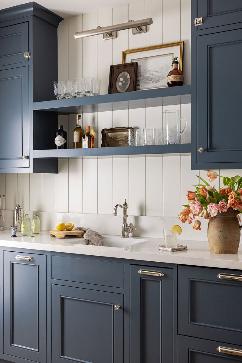 Traditional cottage sink area with natural textures and client-centric design
