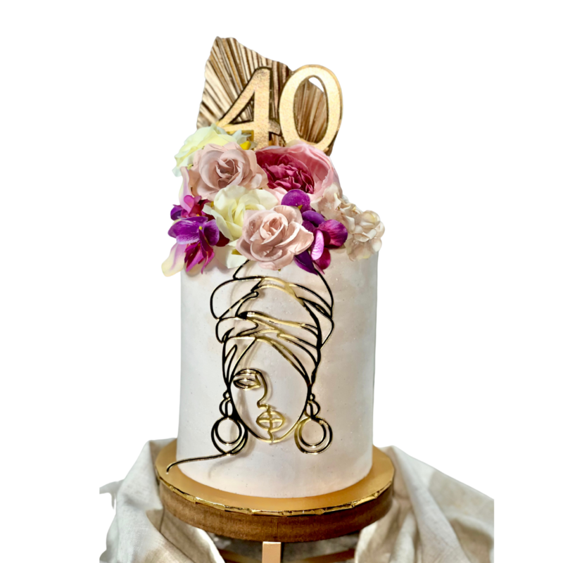Sophisticated line art cake Adorned with a crown of flowers by Artisan Buttercream custom cake bakery serving metro Detroit: birthdays, weddings & more!