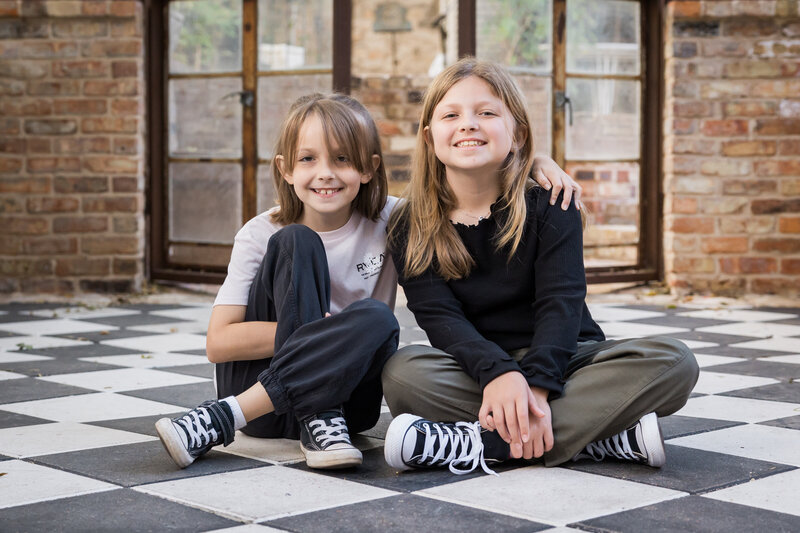 sisters posing together