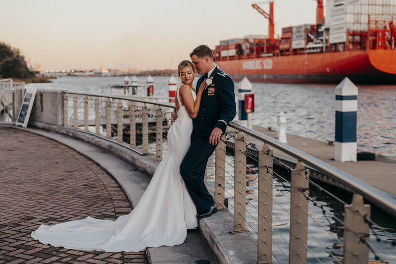 Bride and groom at sunset by the waters edge in Savannah by Low Country  Wedding Photographer