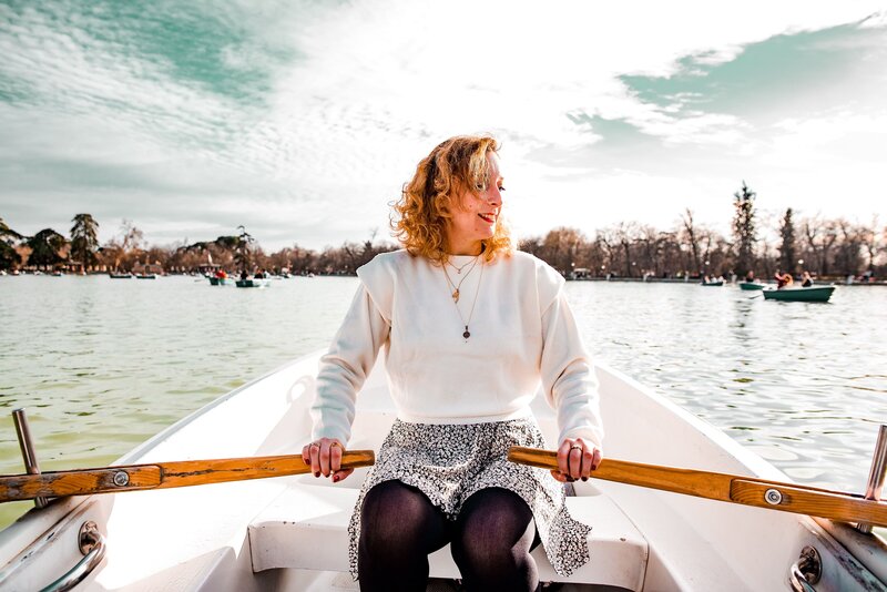 Lady rowing a boat in Madrid, Spain