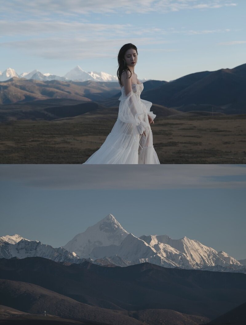 A beautiful woman wearing a couture bridal dress photographed in wild fields with snow capped mountains in the background.
