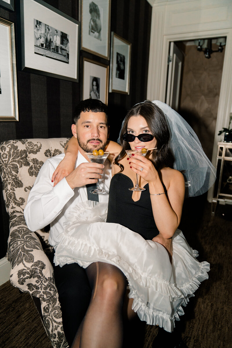 Newport Wedding Photographer | Rhode Island Caprio Captured Photography | Couple Sitting On A Couch While Holding Margarita Glasses