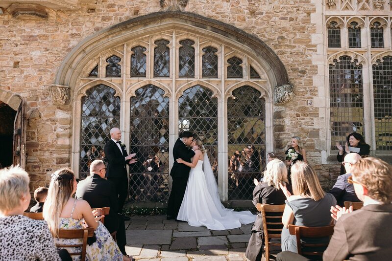 A micro wedding in front of a heritage building at Monsalvat in Victoria.