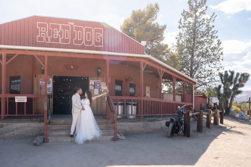Joshua Tree Elopement Bride and Groom at Red Dog Saloon celebrating during lunch.
