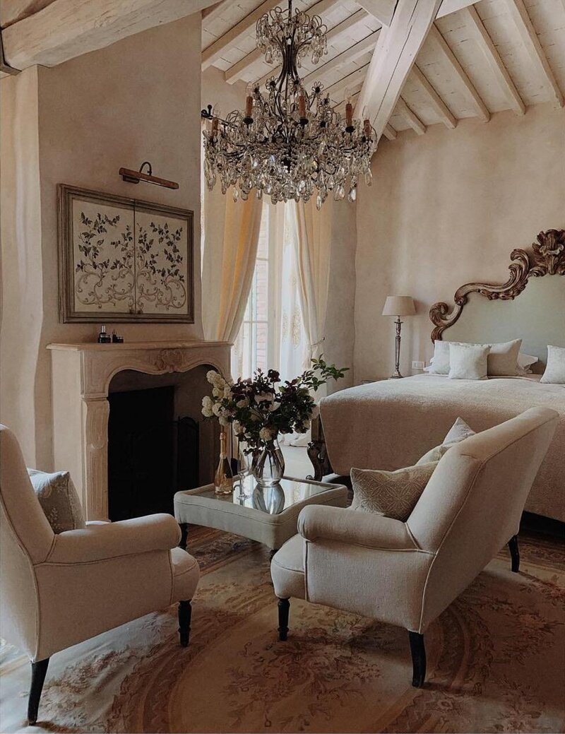 The cream and brown living room of a guest suite at Borgo Santo Pietro