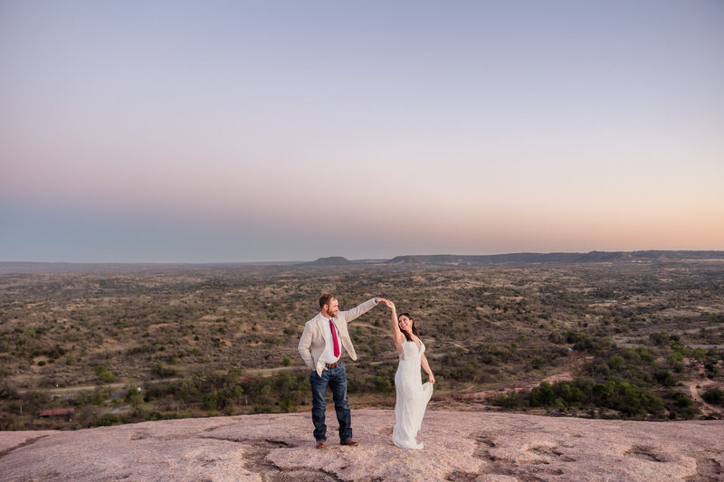 Couple's wedding photo taken at Enchanted Rock in Fredericksburg, Texas.