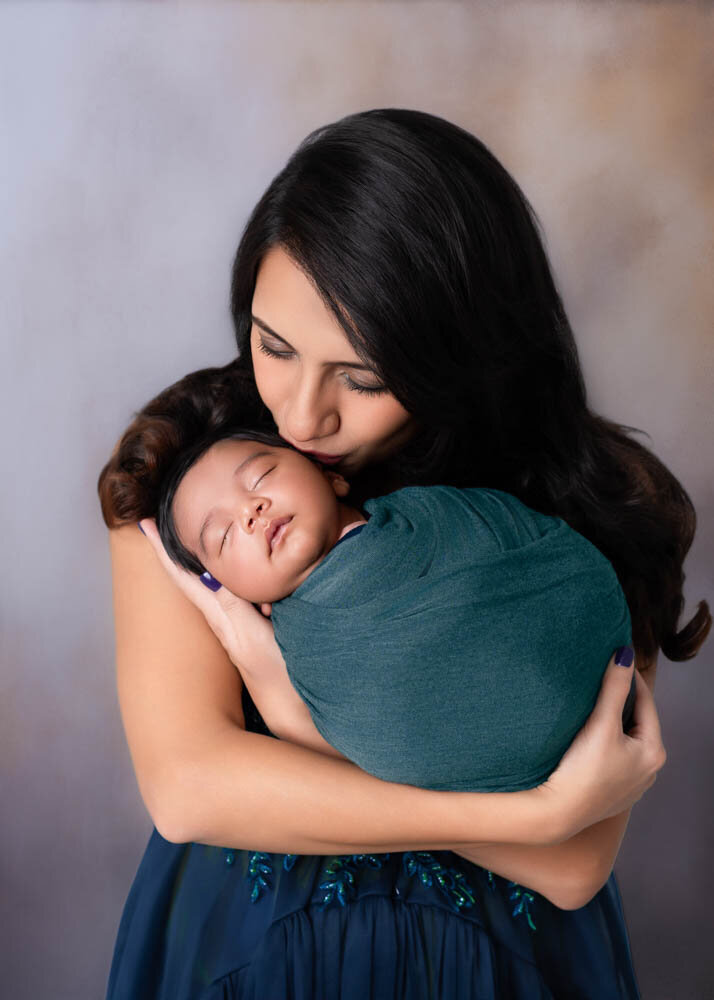 mother-holding-newborn-baby-vertical-portrait