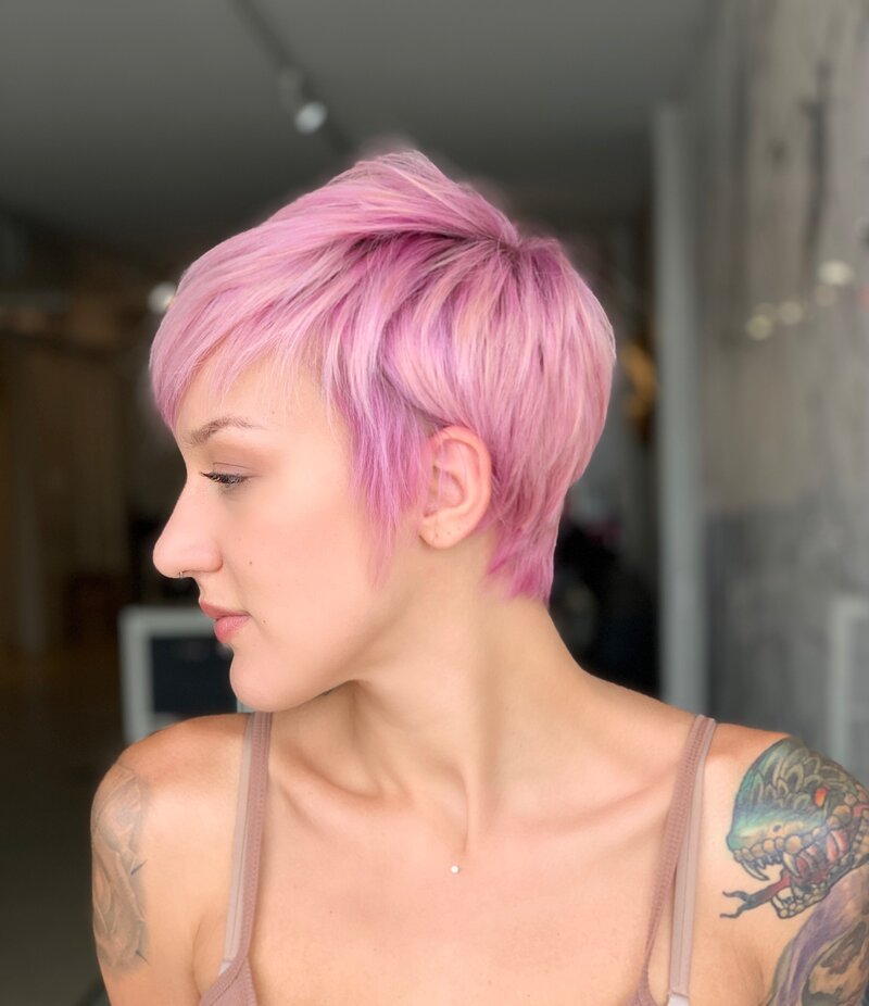 Woman with pink pixie haircut