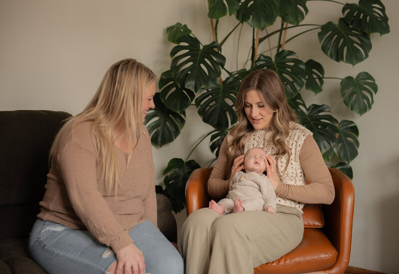 mother watching on as her baby receives craniosacral therapy