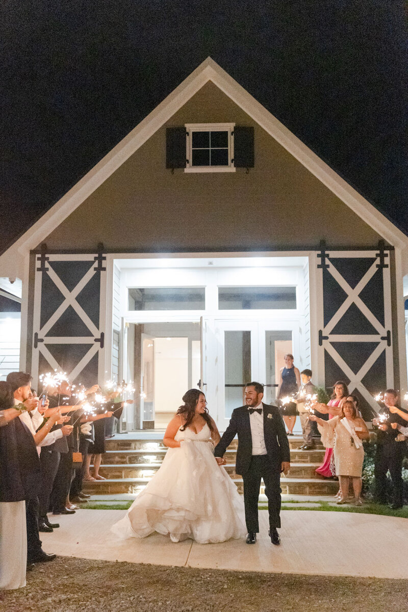Bride and groom sparkler exit at wedding reception