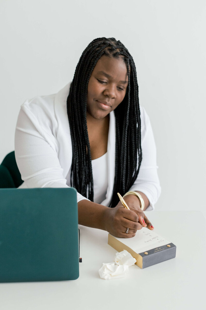 Chessica LaBianca writing on a notepad