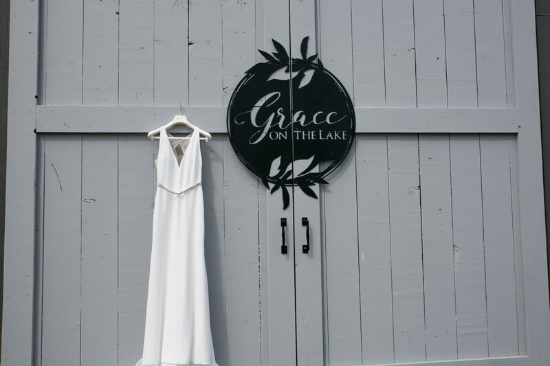 Photo of dress on door of Grace on the Lake Wedding Venue in Harmony, Maine | Wedding Photography