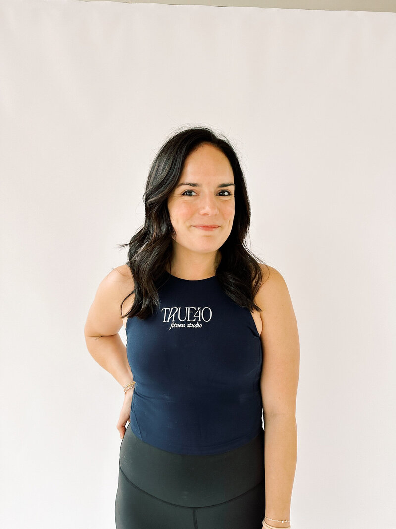 Woman wearing lululemon tank with True40 logo on the front