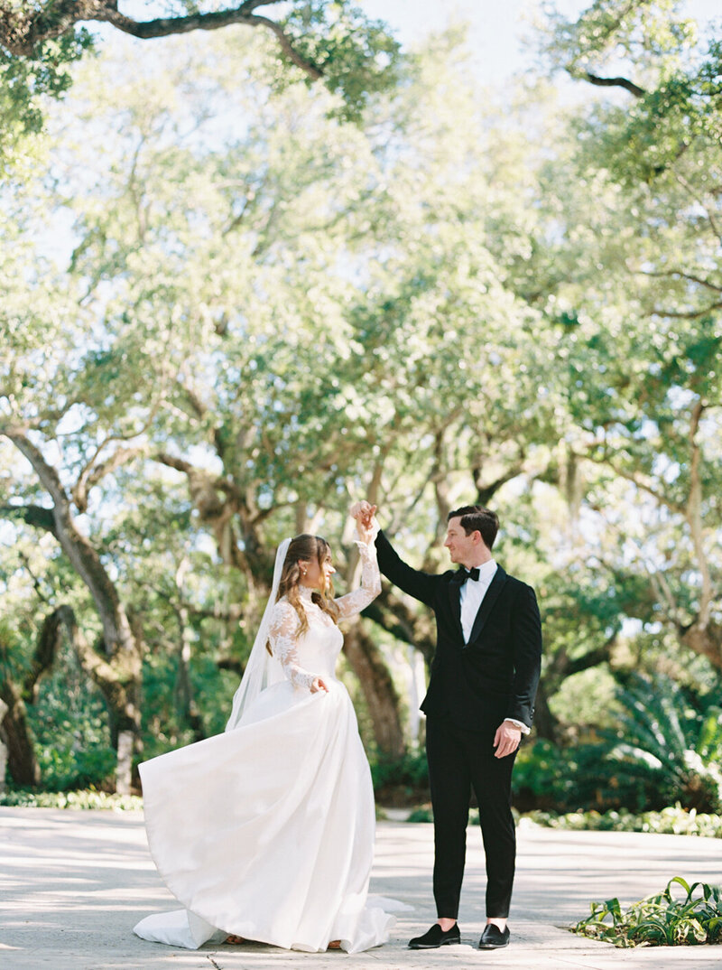 Elegant couple at their Miami wedding at Vizcaya Museum and Gardens, with the bride wearing a timeless Pronovias gown.