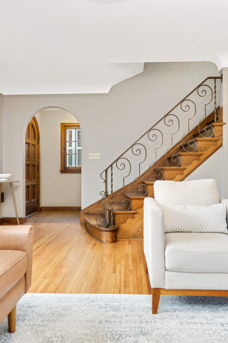Living room and staircase in Twin Cities vintage home